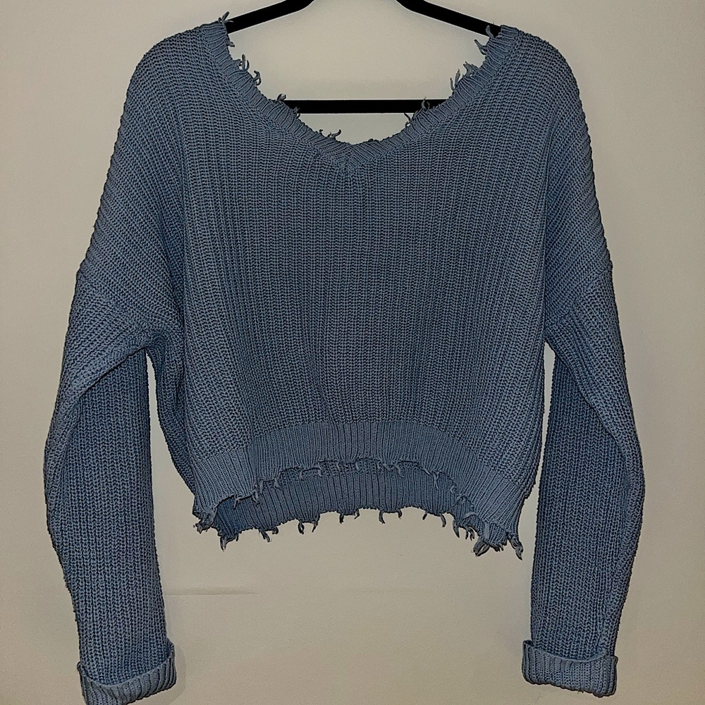 Distressed V-neck / off-the-shoulder knitted sweater